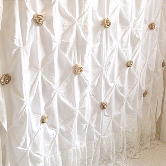 white tufted shower curtain with burlap roses and lace at the bottom