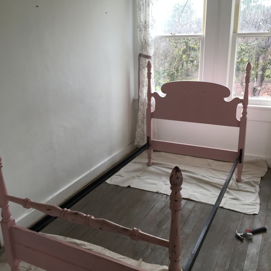 empty pink twin size bed frame