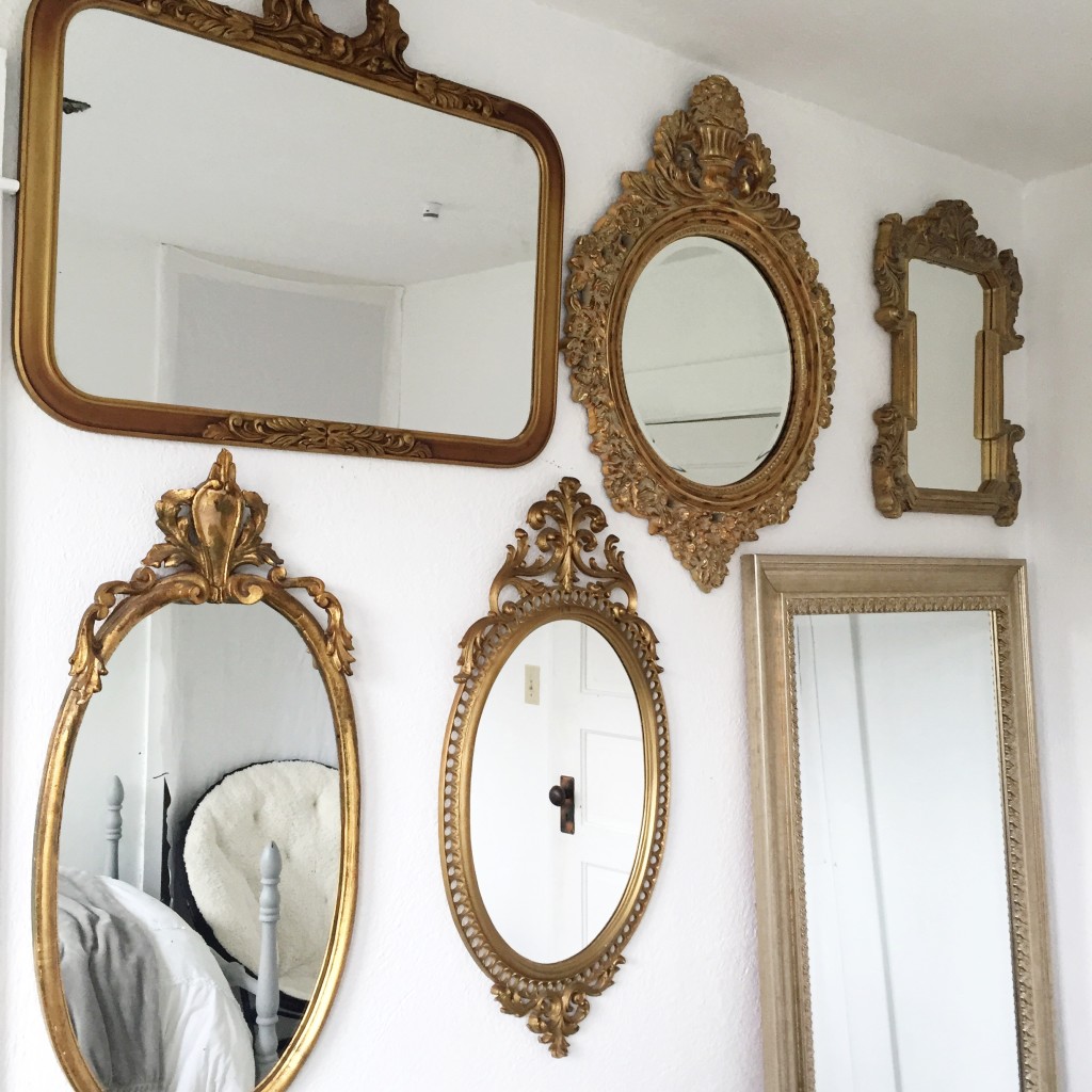 6 vintage gold ornate mirrors hanging on wall