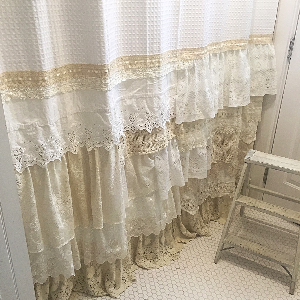 White and Cream lace shower curtain with white heaxogon tile and 3 step white ladder stool