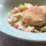 in blue bowl chicken pot pie with biscuit