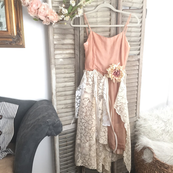 pink and white lace dress hanging on old antique shutters