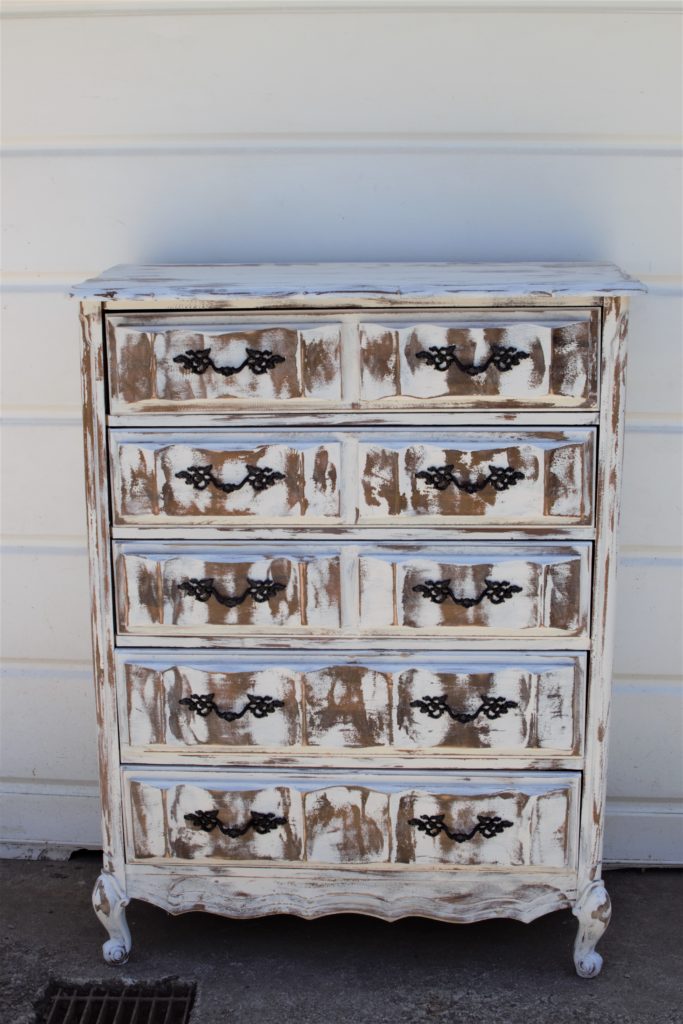 DIY Chippy Paint with Vaseline white chippy painted 8 drawer dresser