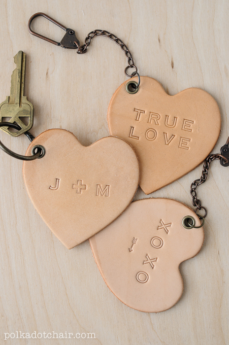 3 leather key chain hearts that say true love, xoxo, j and m