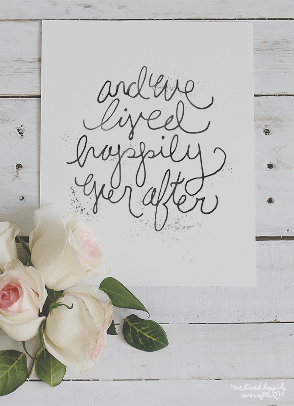 scroll wall print that says and we lived happily ever after with 4 white roses on bottom left