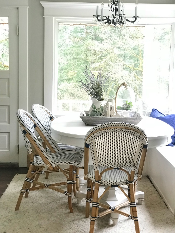 Breakfast Room Table Makeover / Chalk Paint Recipe white farmhouse table with 3 blue and white chairs with woodent tray ontop filled with lavender wreatha dn whtie corbel with cloche