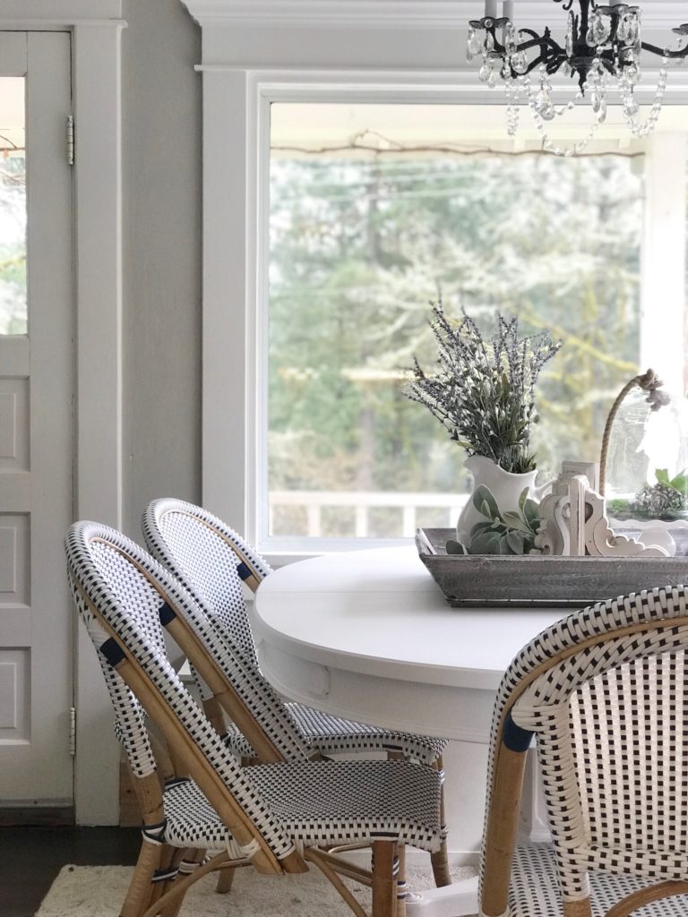 Breakfast Room Table Makeover / Chalk Paint Recipe white farmhouse table with 3 blue and white chairs with woodent tray ontop filled with lavender wreatha dn whtie corbel with cloche