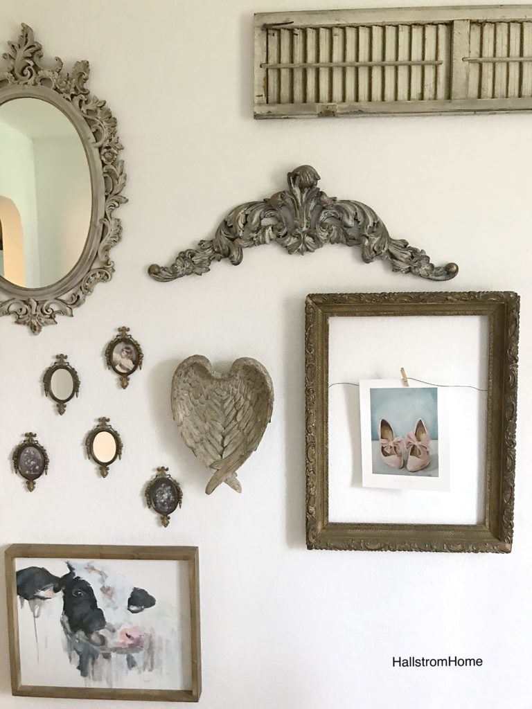 farmhouse gallery wall with frame and sall mirrors and angel wings