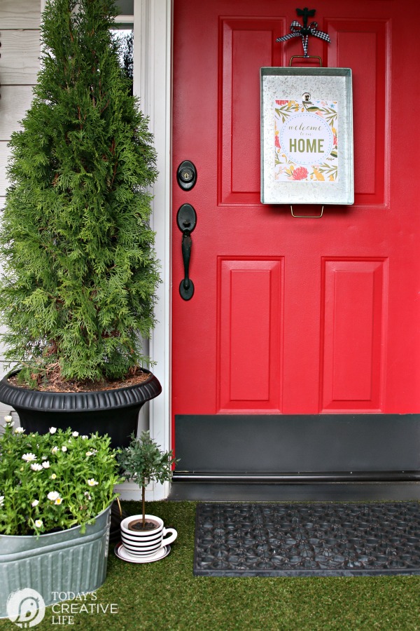 red front door with welcome to our home printable