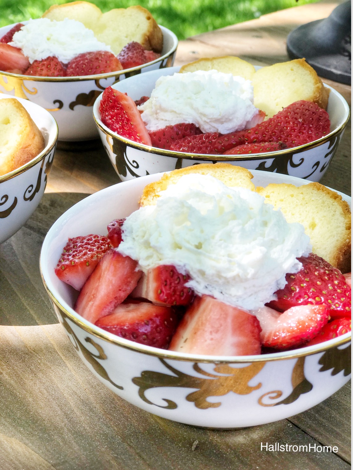 4 bowls of strawberries bread and whip cream