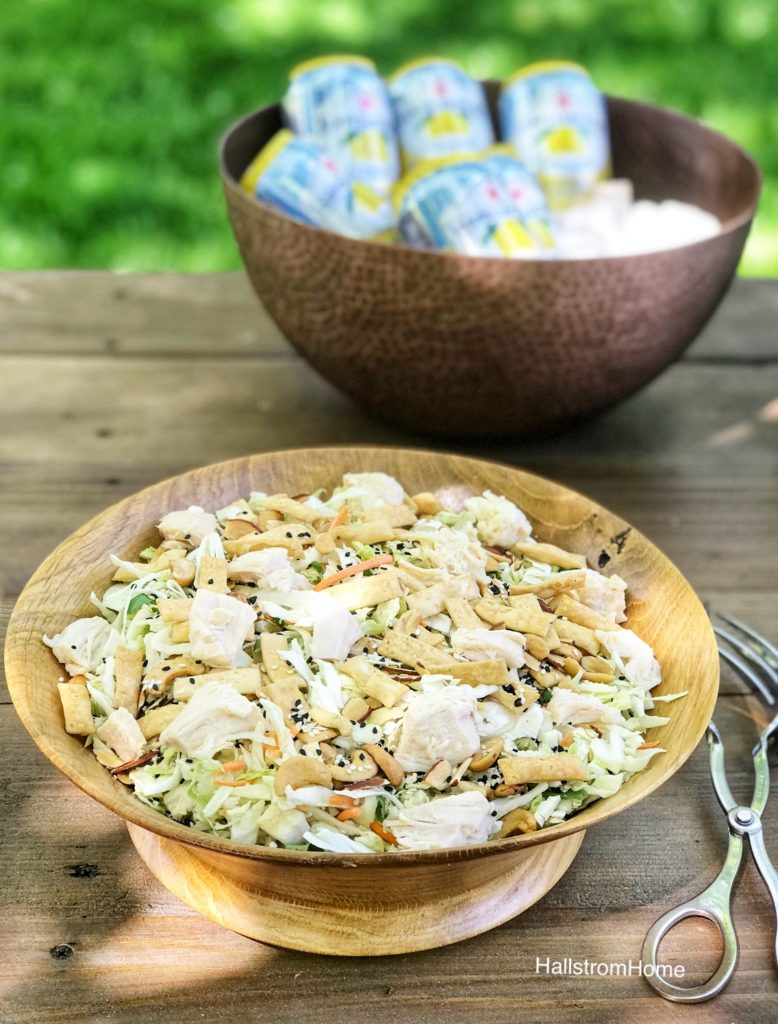 Easy Recipes for Faking a Fancy Brunch asain chicken salad in wooden bowl on table with copper bowl filled with can behind