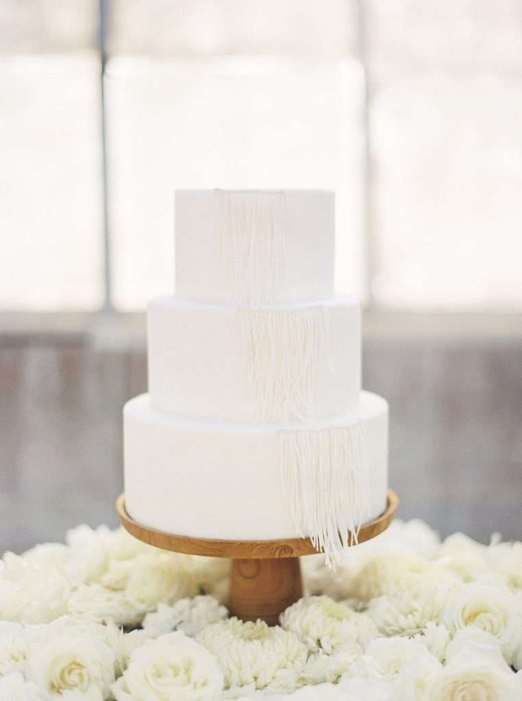 white cake with white fringe