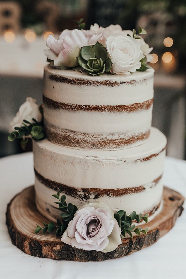 2 tier naked cake with roses and succulents