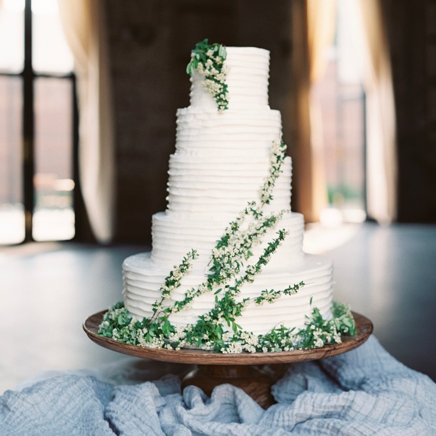 5 tier cake with green and white flowers