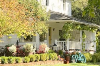 white farmhouse with blue bike