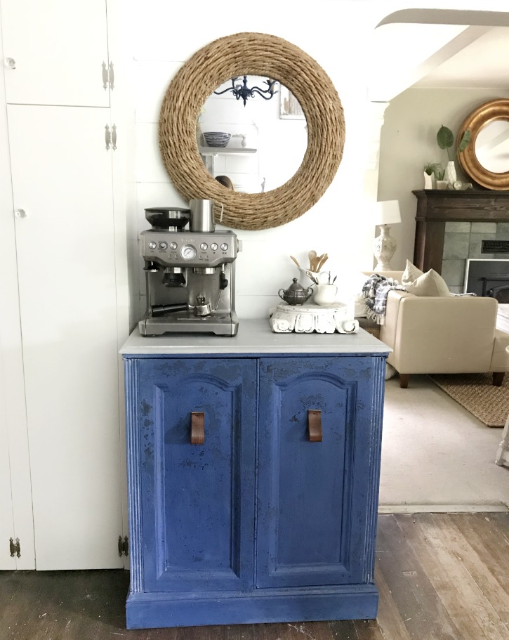 blue coffee bar with woven mirror