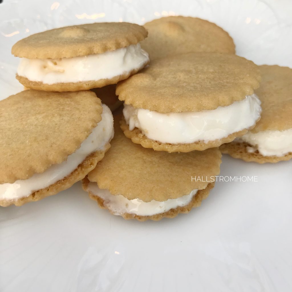 five ice cream sandwiches on white plate