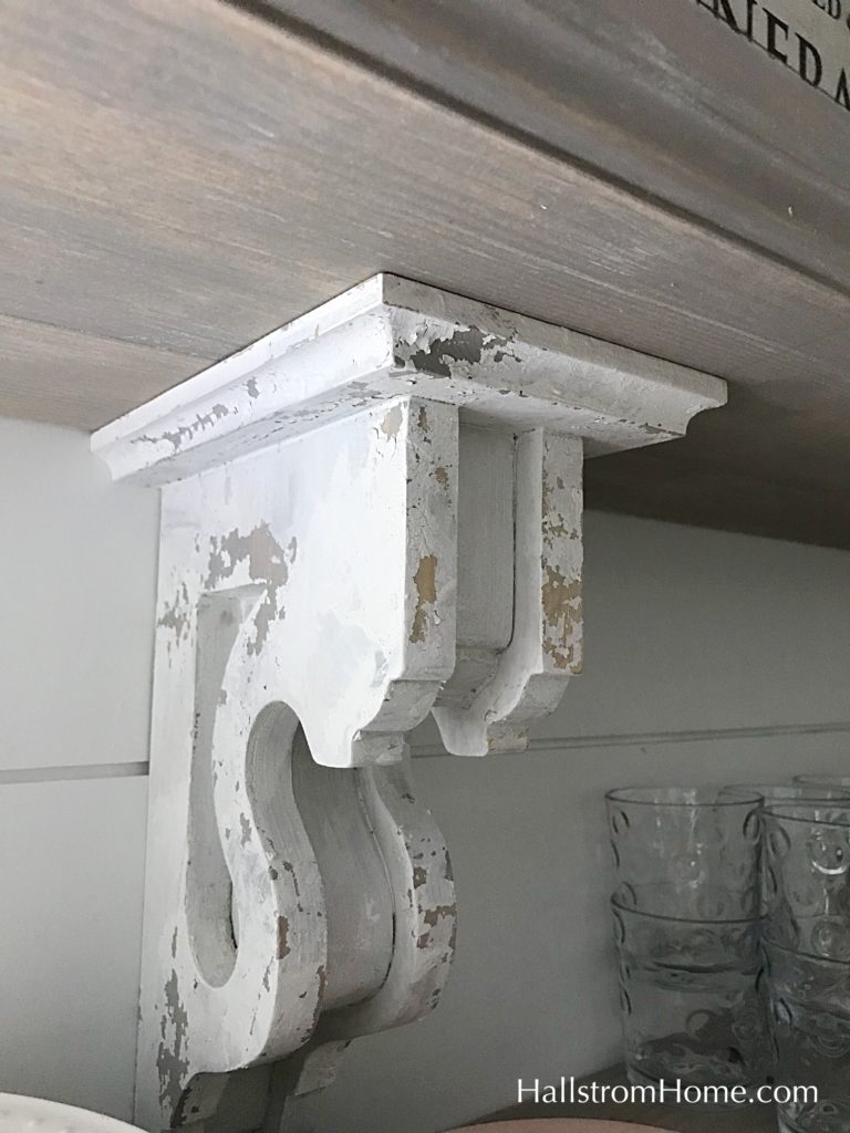 white cippy corbel on white wall