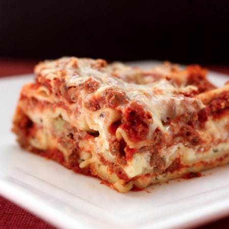 square of lasagna on white plate