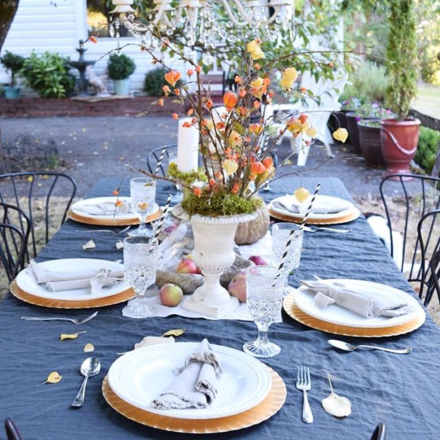 fall table outdoors with apples