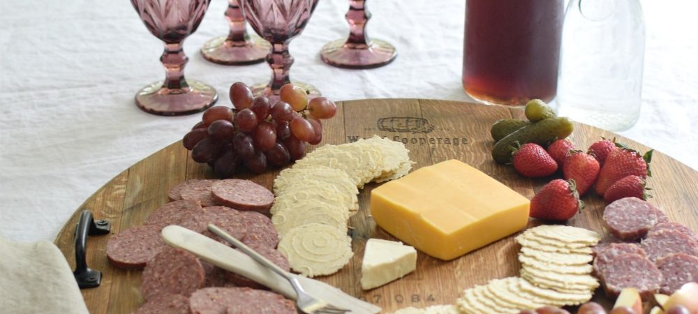 cheese platter with 4 purple cup and pitcher of iced tea