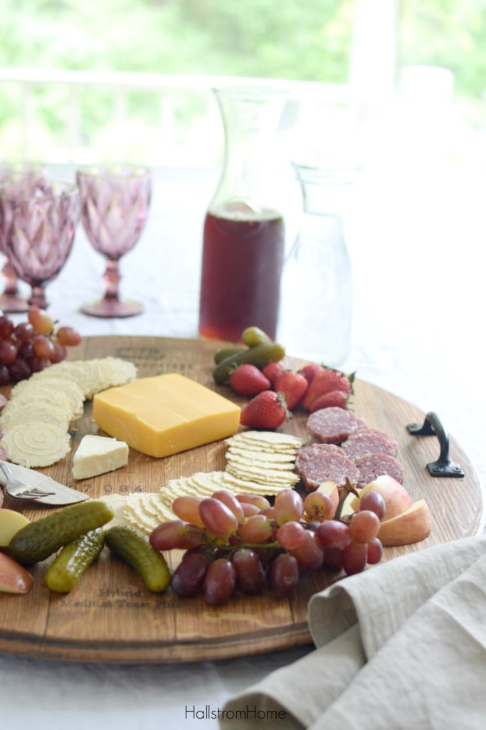 wood platter with cheese and cracker