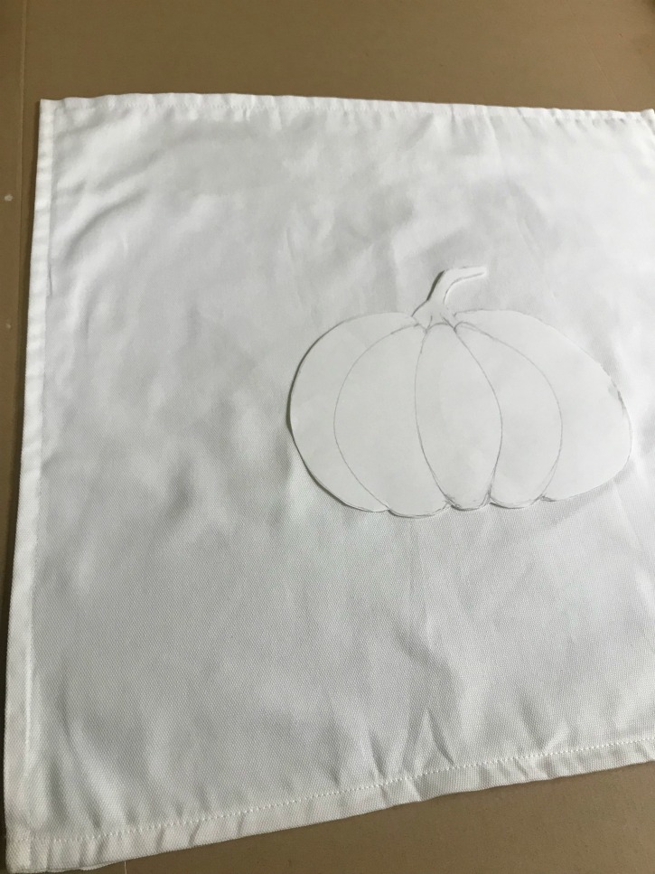 white pillow case with drawing of pumpkin