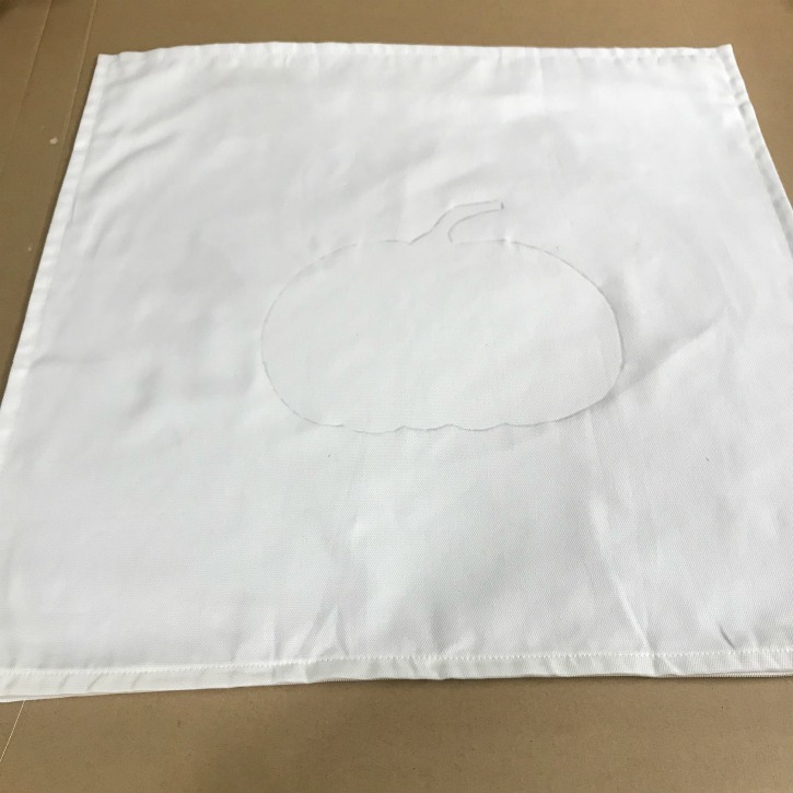 trace of pumpkin on white pillow case