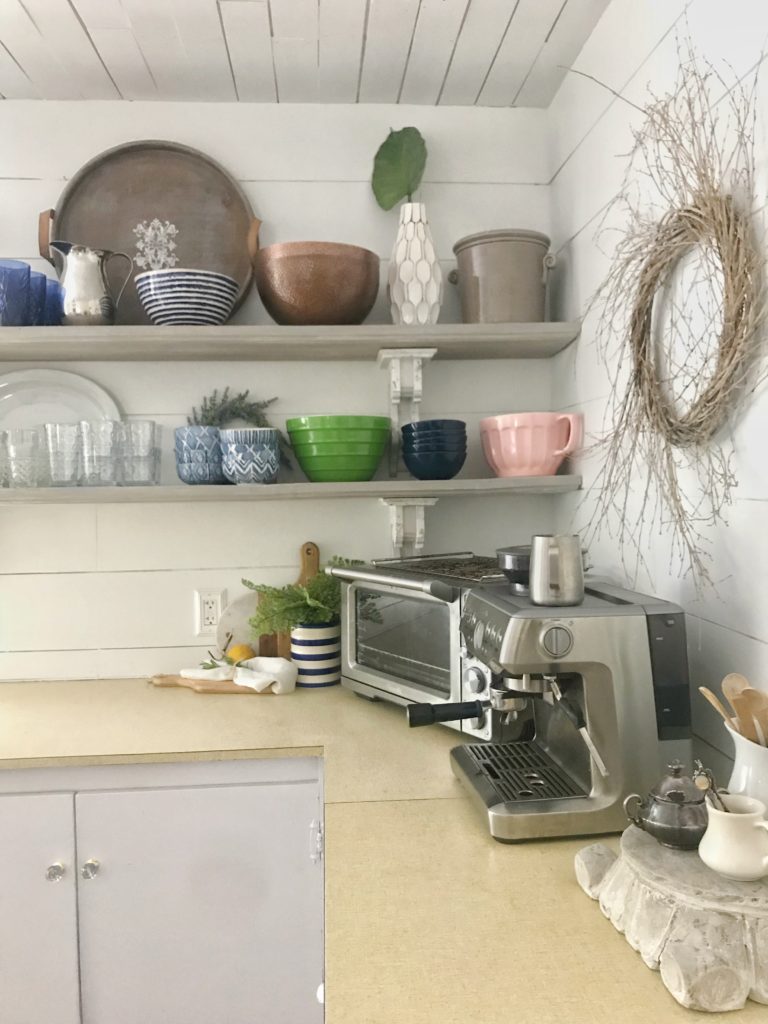 How to Organize Your Kitchen for Open Shelving with cups plates bowls