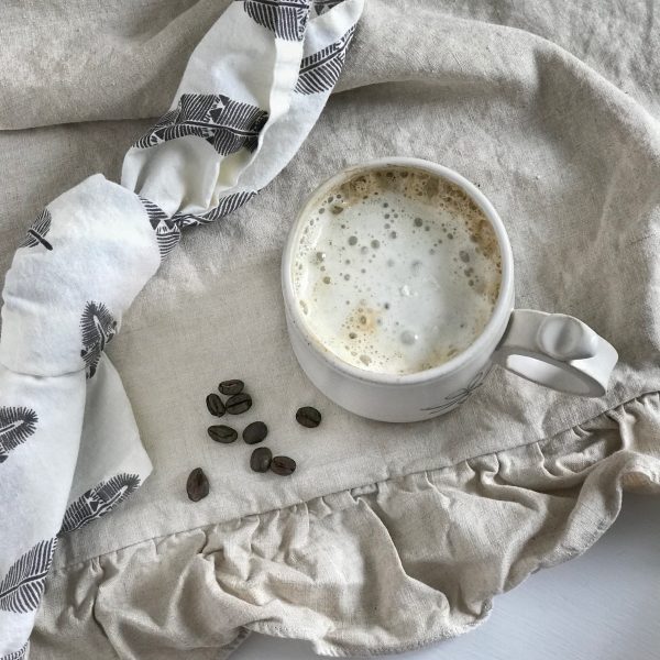 Salted Caramel Pumpkin Spice Coffee Salted Caramel Pumpkin Spice Coffee mug with coffee beans next to it