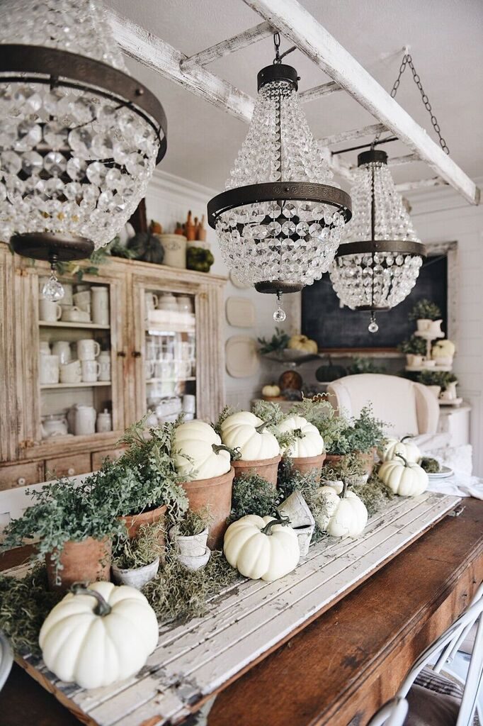 white pumpkins in pots in table centerpiece