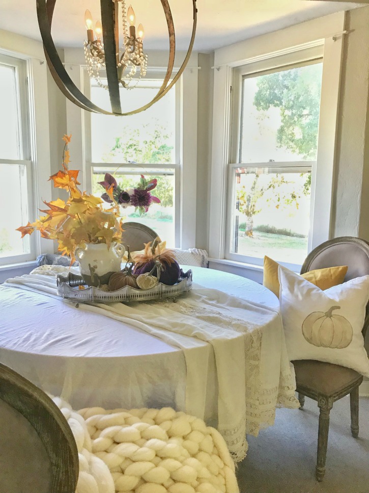 dining room fall table with pumpkin pillow and white table cloth with leave Beautiful Fall Farmhouse Home Tour with Easy Scone Recipe 