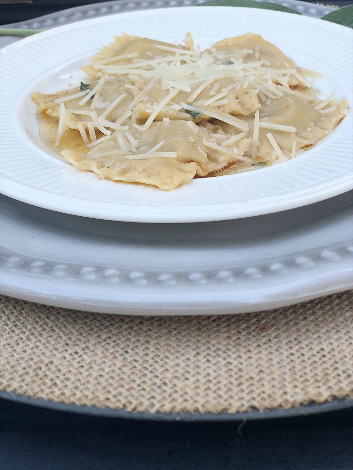 white bowl full of ravioli