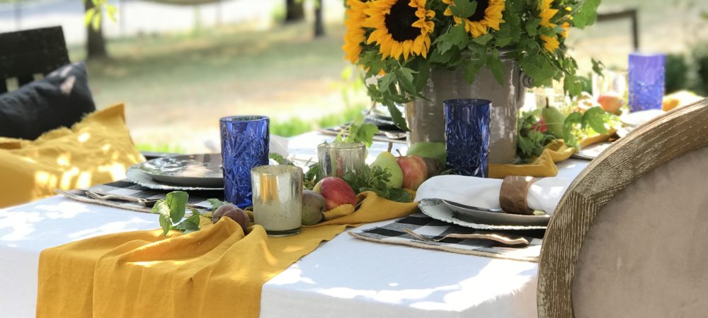 How to Decorate Your Fall Table in the Garden with yellow table runner and sunflower centerpiece