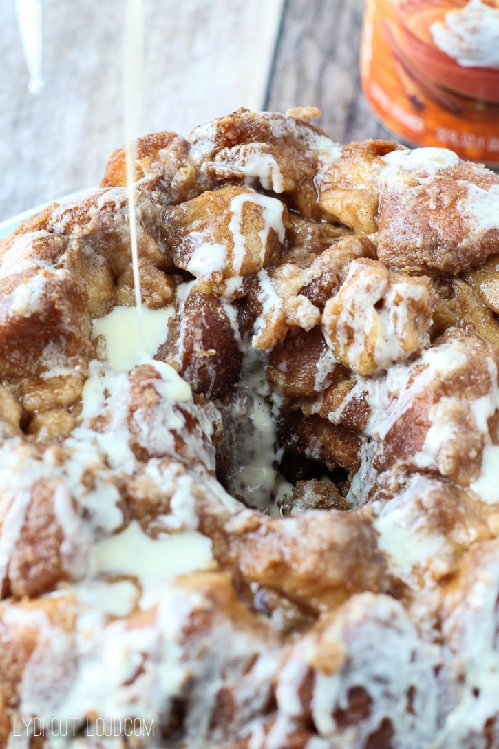 monkey bread with icing being drizzled on