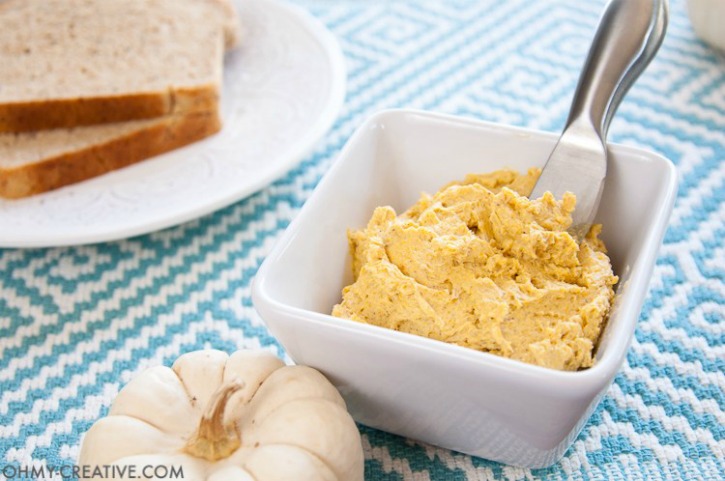 pumpkin butter in white glass with white pumpkin next to it