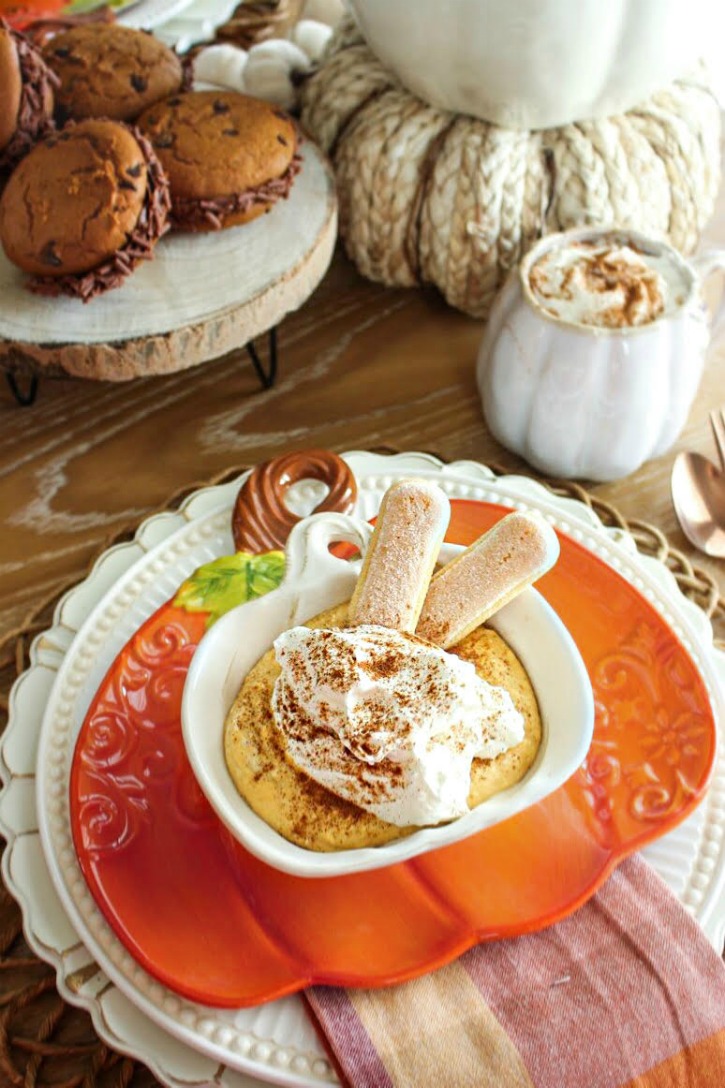 tiramisu in cup on orange plate