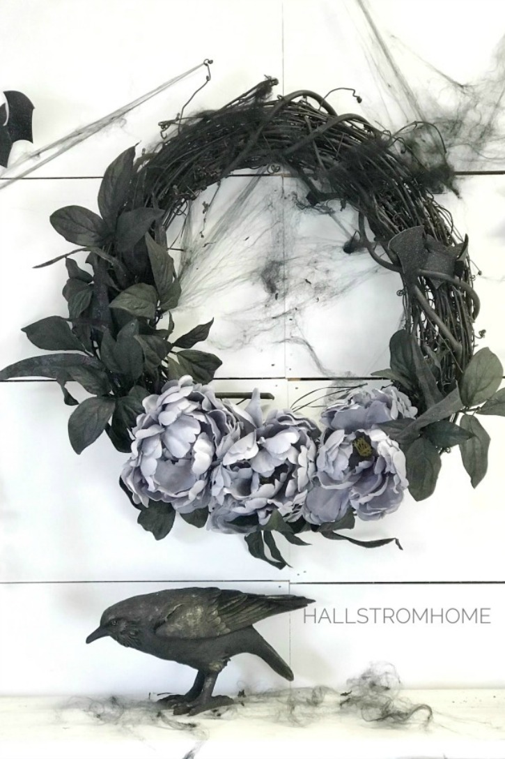 #1 Halloween Wreath that's Easy Elegant and Beautiful black wreath with purple flowers and black webs