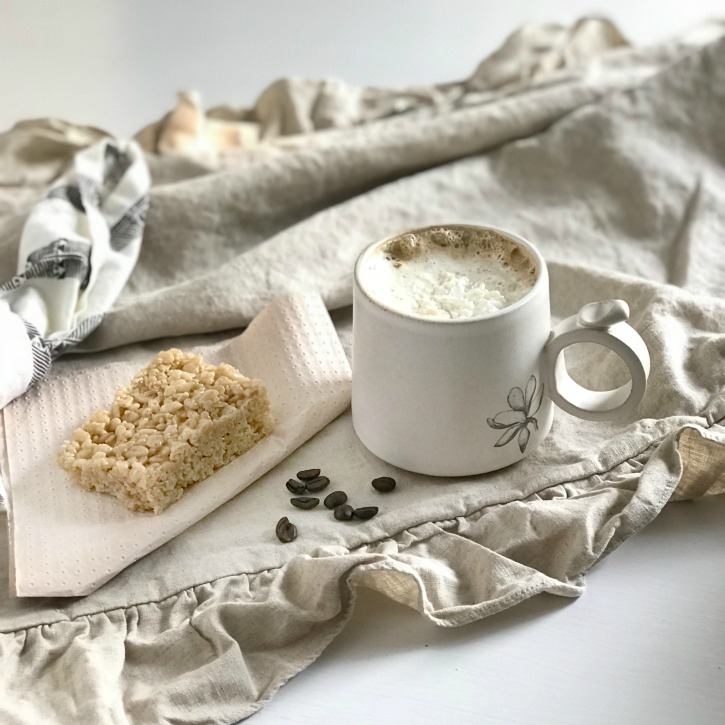 Amazing Salted Caramel Pumpkin Spice Latte Recipe with coffee and coffee beans on ruffle linen with knotted napkin