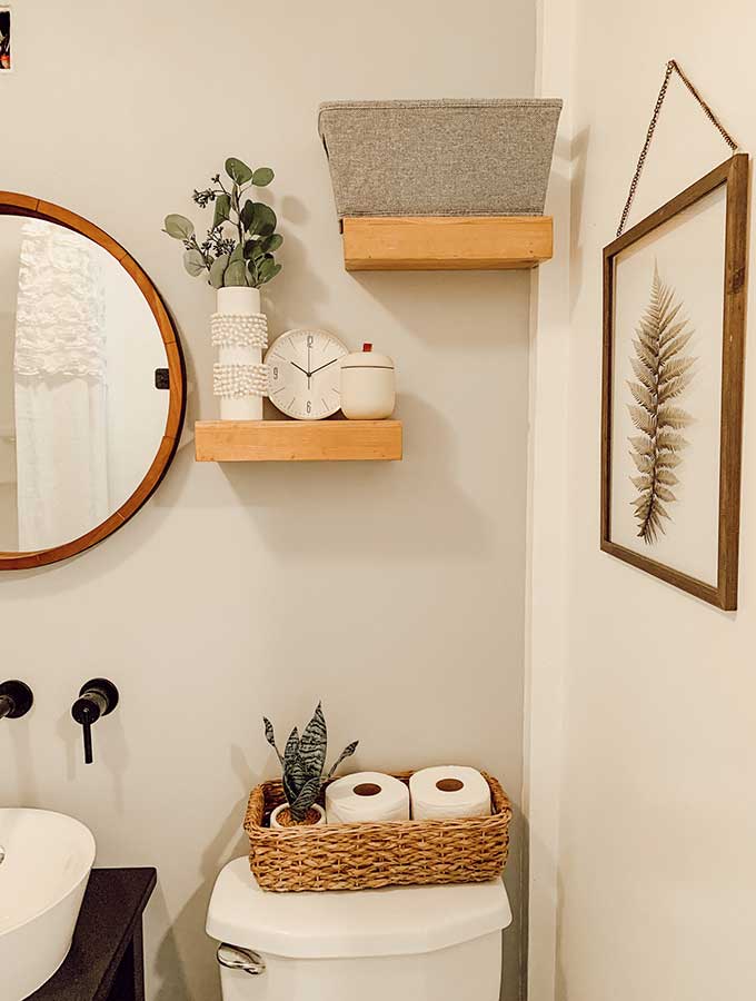 Small Bathroom Makeover Ideas|guest bathroom|powder room|paint color|bathroom makeovers|small bathroom makeover|small bathroom|storage space|bathroom remodels|before and after|pedestal sink|earth elements|bathroom faucet|delta faucets|sponsored|sink faucet|floor tiles|Hallstrom Home