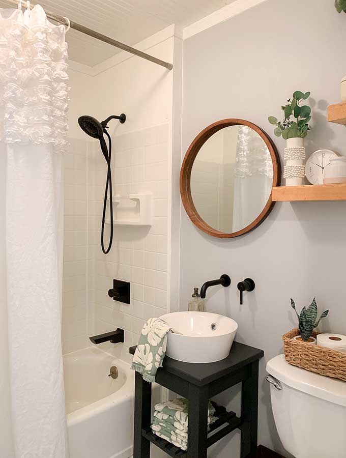 Small Bathroom Makeover Ideas|guest bathroom|powder room|paint color|bathroom makeovers|small bathroom makeover|small bathroom|storage space|bathroom remodels|before and after|pedestal sink|earth elements|bathroom faucet|delta faucets|sponsored|sink faucet|floor tiles|Hallstrom Home