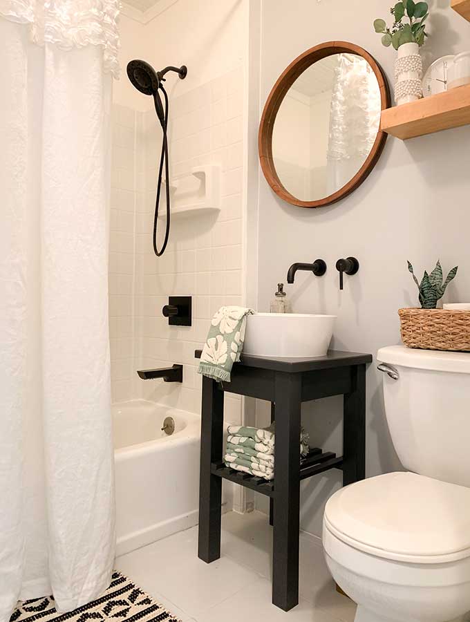 Small Bathroom Makeover Ideas|guest bathroom|powder room|paint color|bathroom makeovers|small bathroom makeover|small bathroom|storage space|bathroom remodels|before and after|pedestal sink|earth elements|bathroom faucet|delta faucets|sponsored|sink faucet|floor tiles|Hallstrom Home