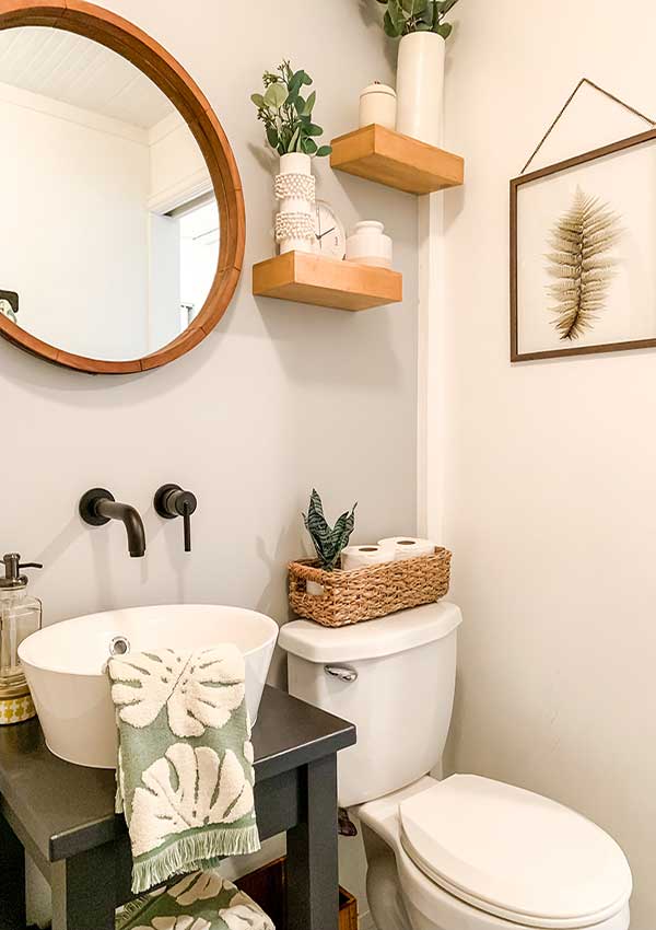 Small Bathroom Makeover Ideas|guest bathroom|powder room|paint color|bathroom makeovers|small bathroom makeover|small bathroom|storage space|bathroom remodels|before and after|pedestal sink|earth elements|bathroom faucet|delta faucets|sponsored|sink faucet|floor tiles|Hallstrom Home