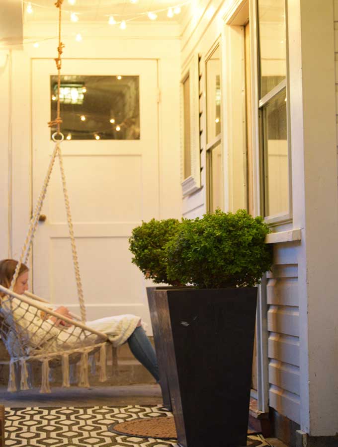 Hygge Porch Design with Swing|hygge life|hygge products|adding hygge|hygge chairs|hygge decor|simple porch designs|Scandinavian Porch|porch design ideas|boho porch|boho home|bohemian decor|Hallstrom Home 