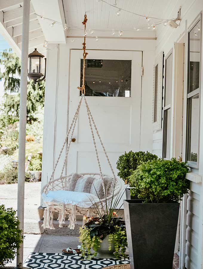 Hygge Porch Design with Swing|hygge life|hygge products|adding hygge|hygge chairs|hygge decor|simple porch designs|Scandinavian Porch|porch design ideas|boho porch|boho home|bohemian decor|Hallstrom Home 