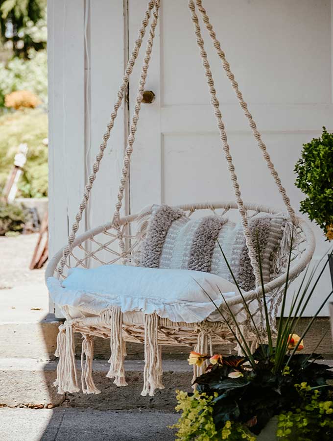 Hygge Porch Design with Swing |hygge life|hygge products|adding hygge|hygge chairs|hygge decor|simple porch designs|Scandinavian Porch|porch design ideas|boho porch|boho home|bohemian decor|Hallstrom Home 