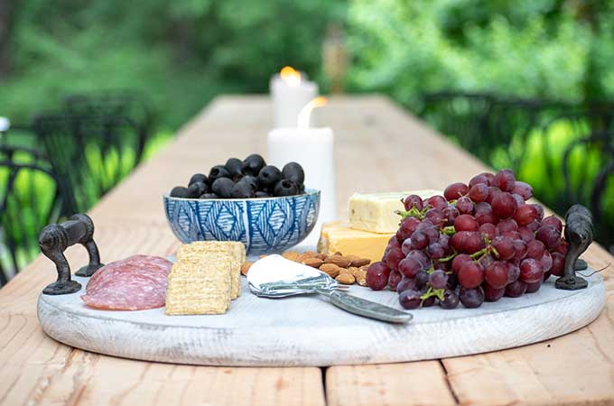 How to Use a Charcuterie Board for Entertaining|outdoor entertaining|how to assemble cheese board|cheese platter presentation|cheese platter appetizer|Farmhouse dining|outdoor dining|veranda|party planning|appetizer recipes|best recipes|party recipes|entertaining recipes|hallstrom home