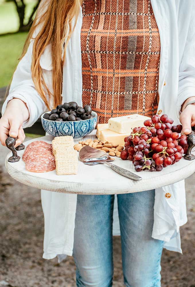 How to Use a Charcuterie Board for Entertaining|outdoor entertaining|how to assemble cheese board|cheese platter presentation|cheese platter appetizer|Farmhouse dining|outdoor dining|veranda|party planning|appetizer recipes|best recipes|party recipes|entertaining recipes|hallstrom home