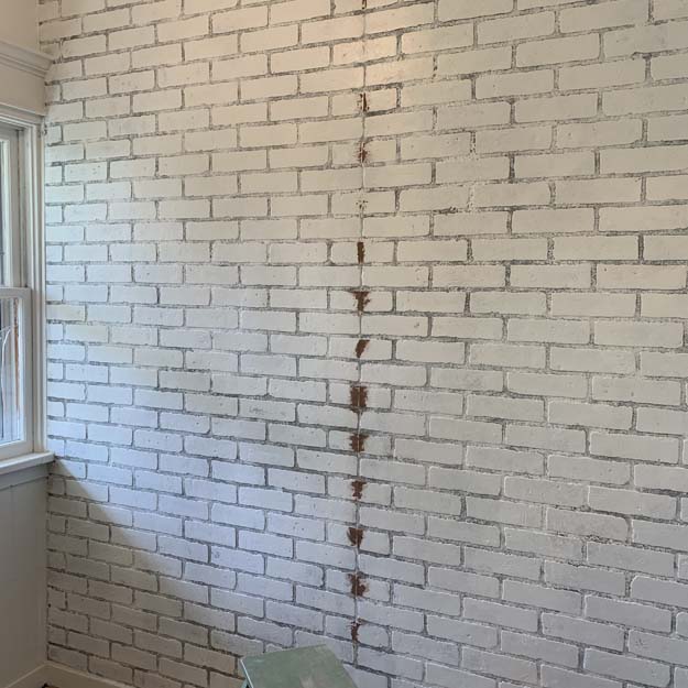 How to Install Faux Brick Wall |faux brick|faux brick panel|how to paint faux brick|install faux brick|farmhouse brick wall|accent wall|brick wall accent|faux brick accent wall|how to hide wall seams|how to hide seems in brick paneling|farmhouse decor|farmhouse accents| Hallstrom Home