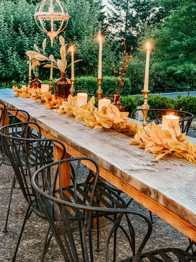 Outdoor Fall Tablescape with Leaves |fall table settings|farmhouse table|fall farmhouse table|farmhouse decor|fall leaves|fall leaf diy|outdoor tablescape|fall table settings|amber jars|fall centerpiece|amber fall decor|fall diy|fall craft|Hallstrom Home